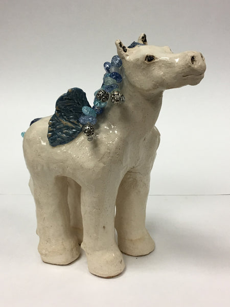 10 inches high by 7 inches long by 2 inches wide.  Clay with beaded mane and tail.
